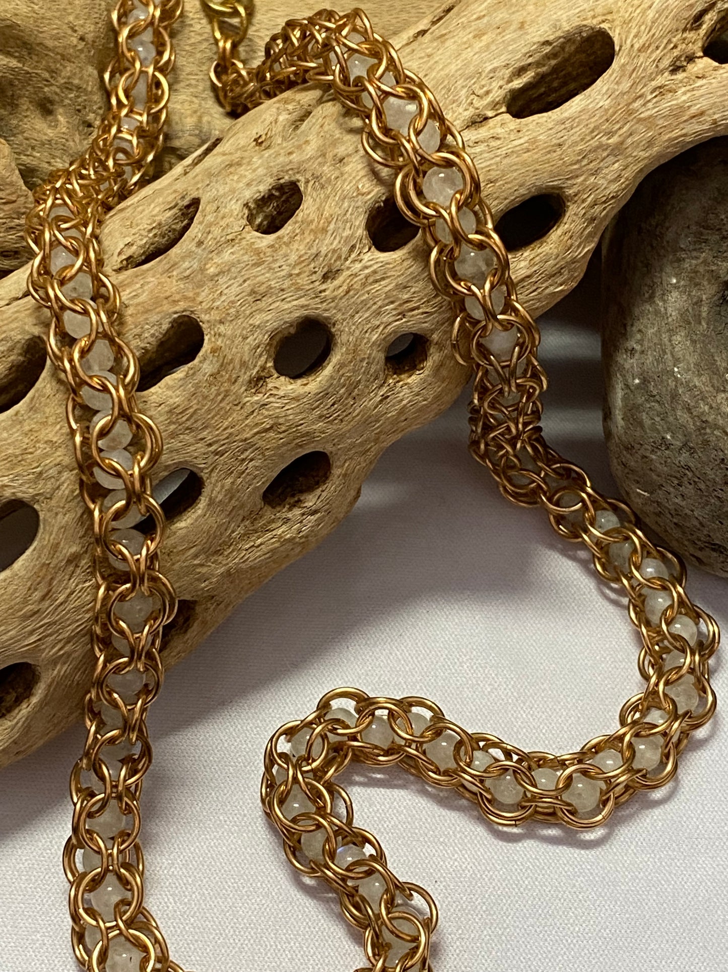 Bronze necklace with captive moonstone beads, 20 inches long