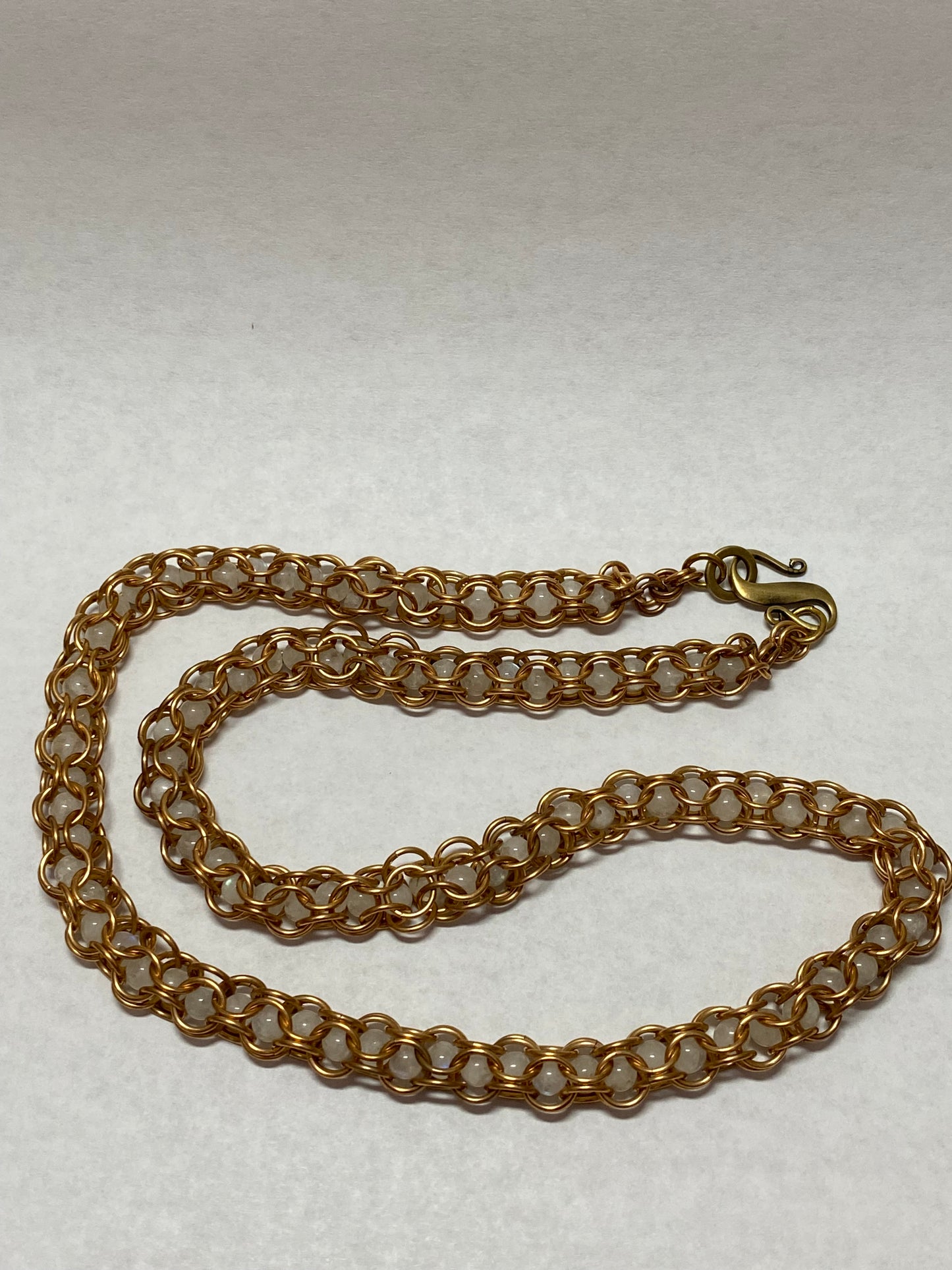 Bronze necklace with captive moonstone beads, 20 inches long